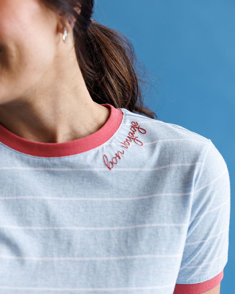 Light blue "Bon Voyage" shirt with red trim – close-up