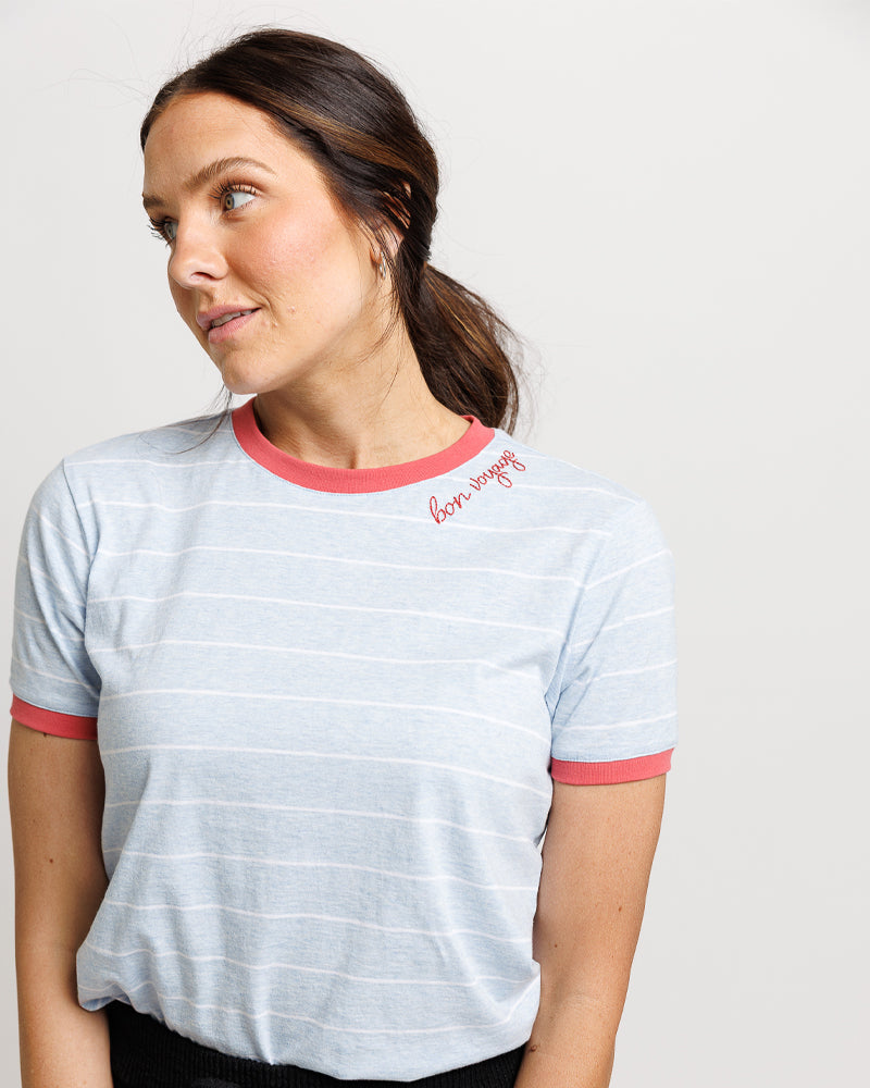 Woman wearing a light blue striped t-shirt all in cotton