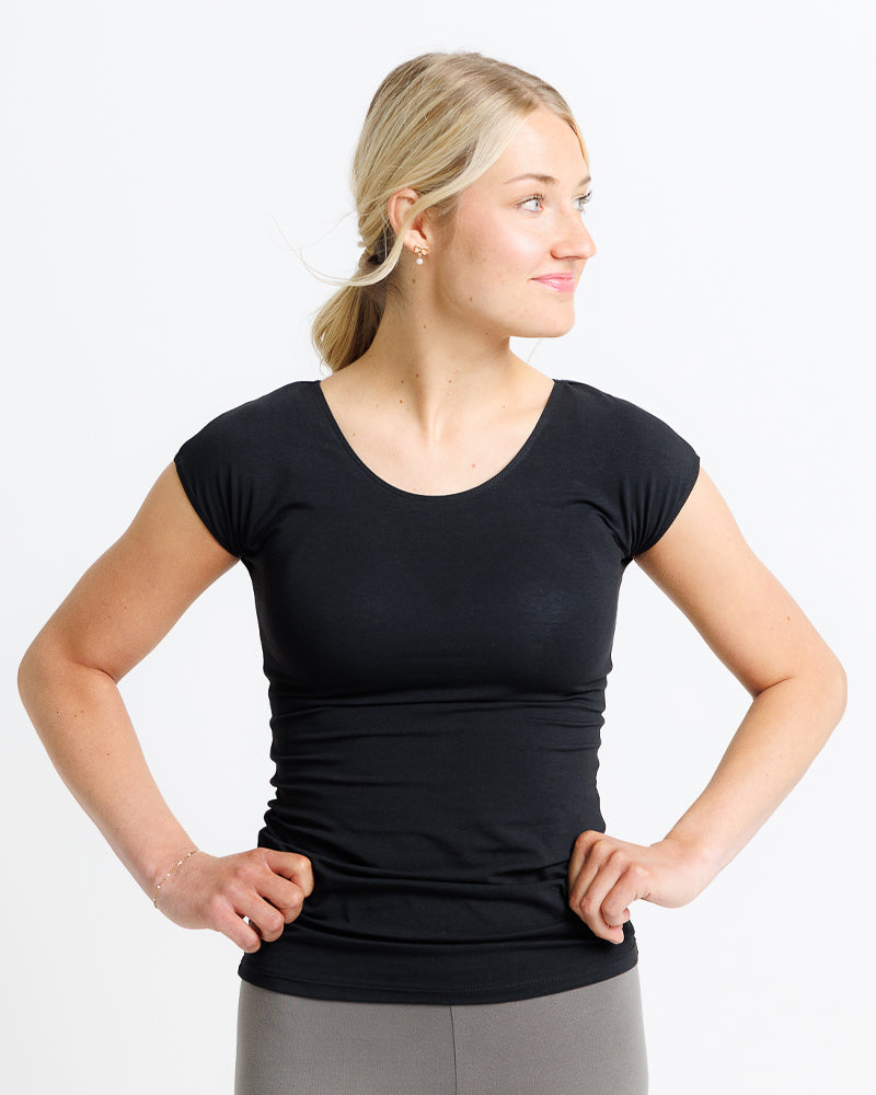 Woman wearing a black t-shirt  made of 100 percent softest cotton