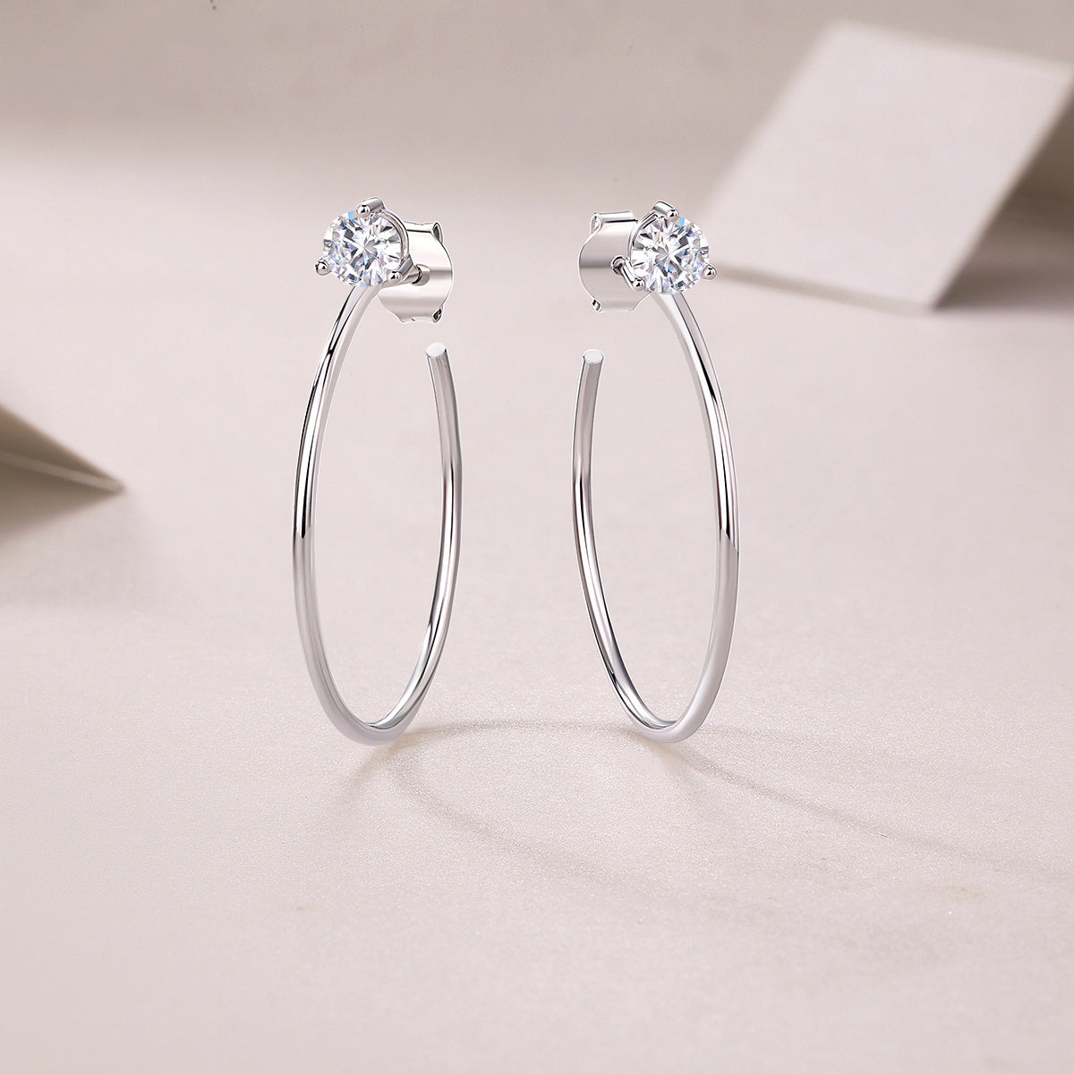 Silver hoop earrings with clear moissanite diamond