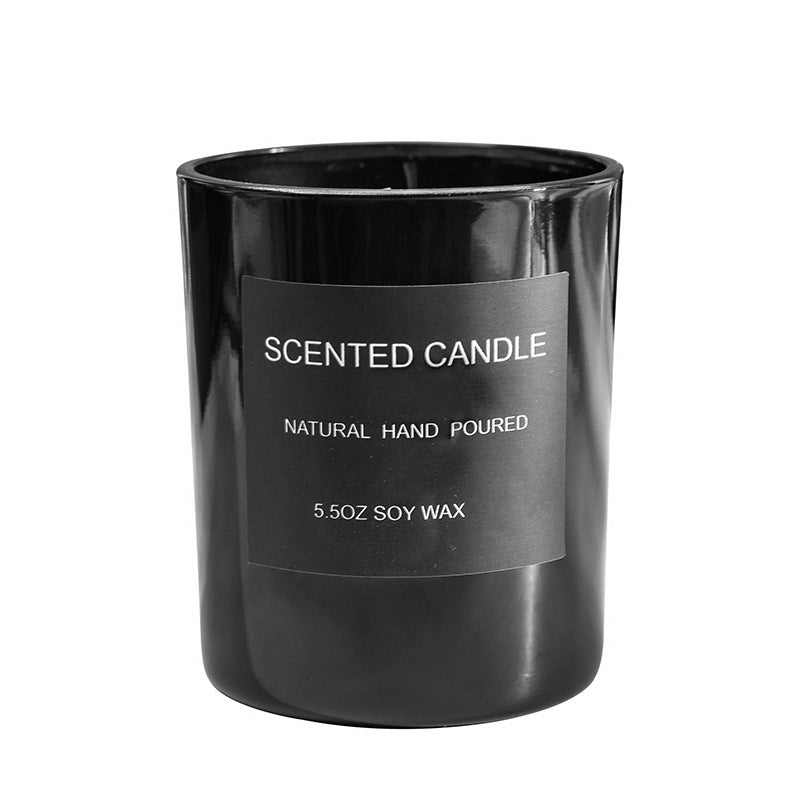 Black scented candle with a label of natural hand poured soy was