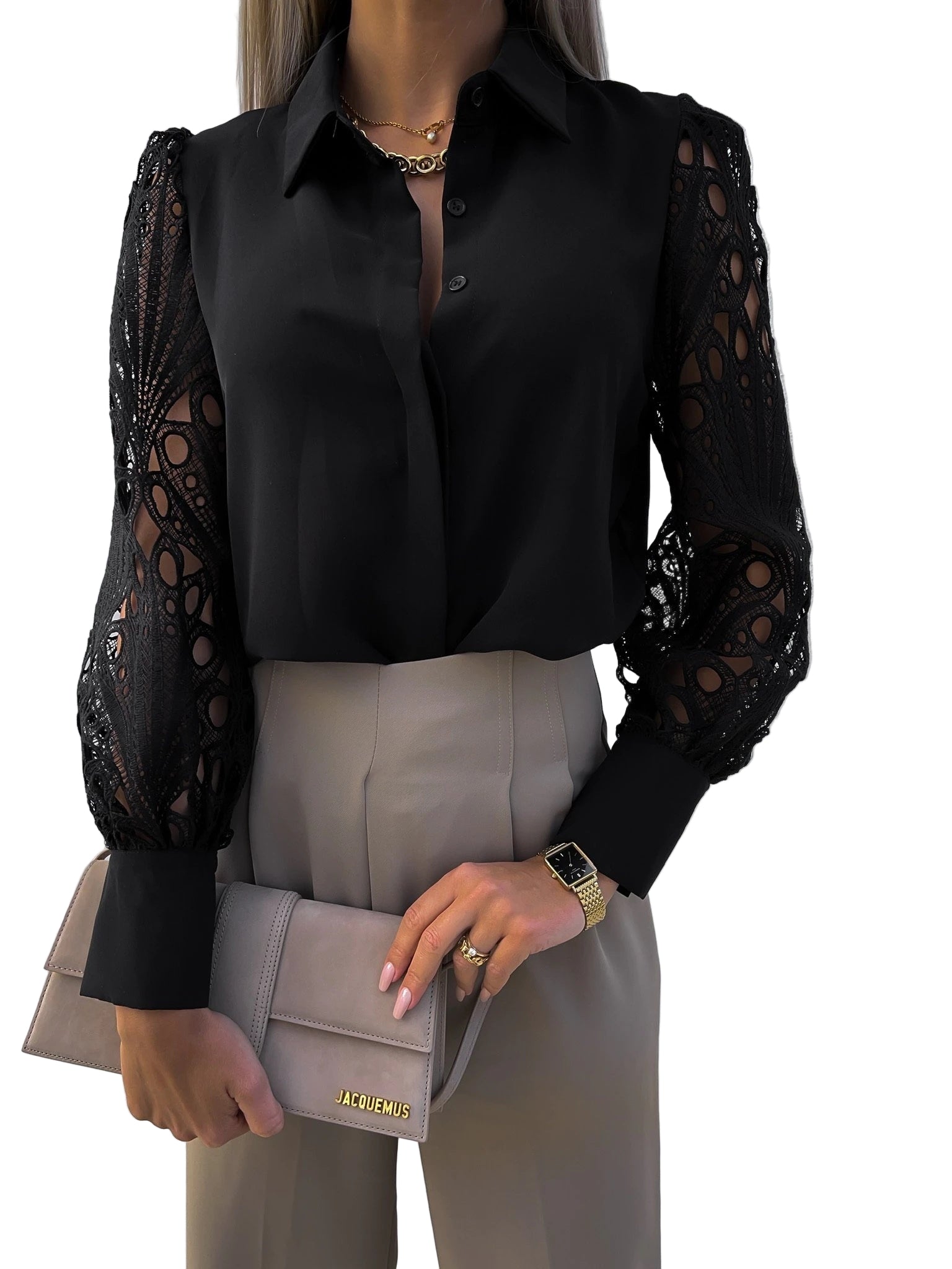Black blouse with sheer sleeves and beige pants