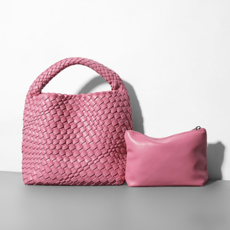 designer pink woven handbag