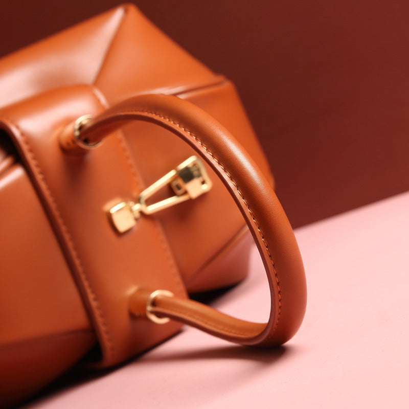 Brown leather handbag with gold hardware