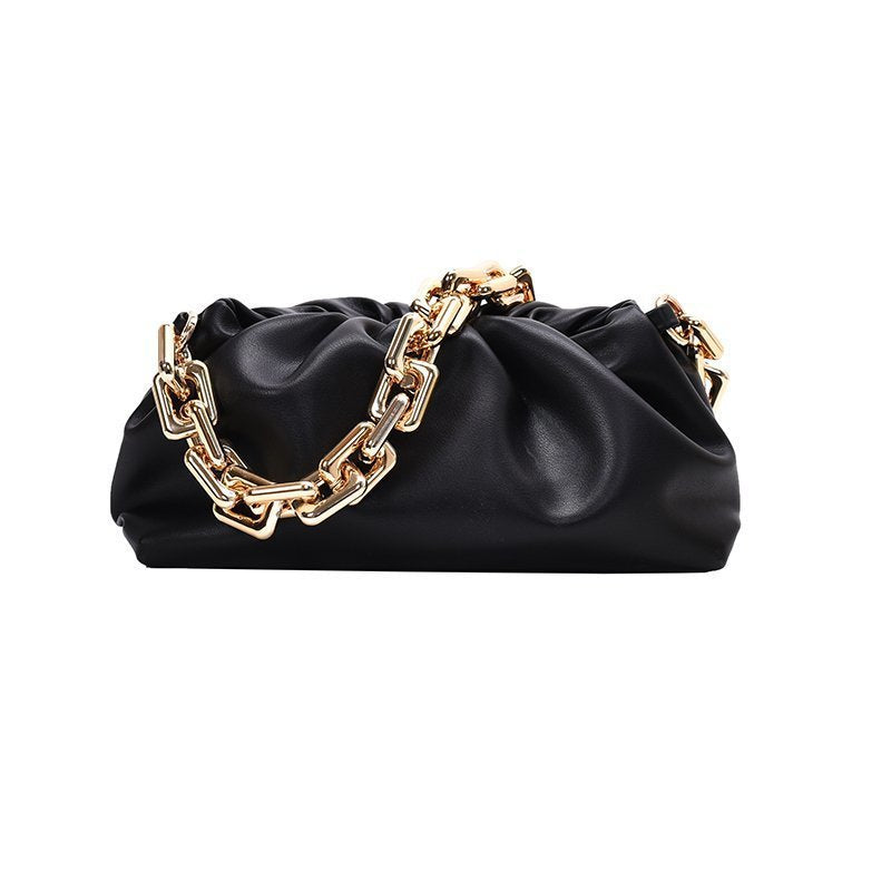 Black handbag with gold chain