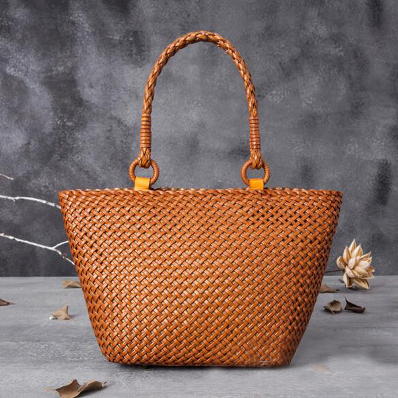 Brown woven handbag with braided handles