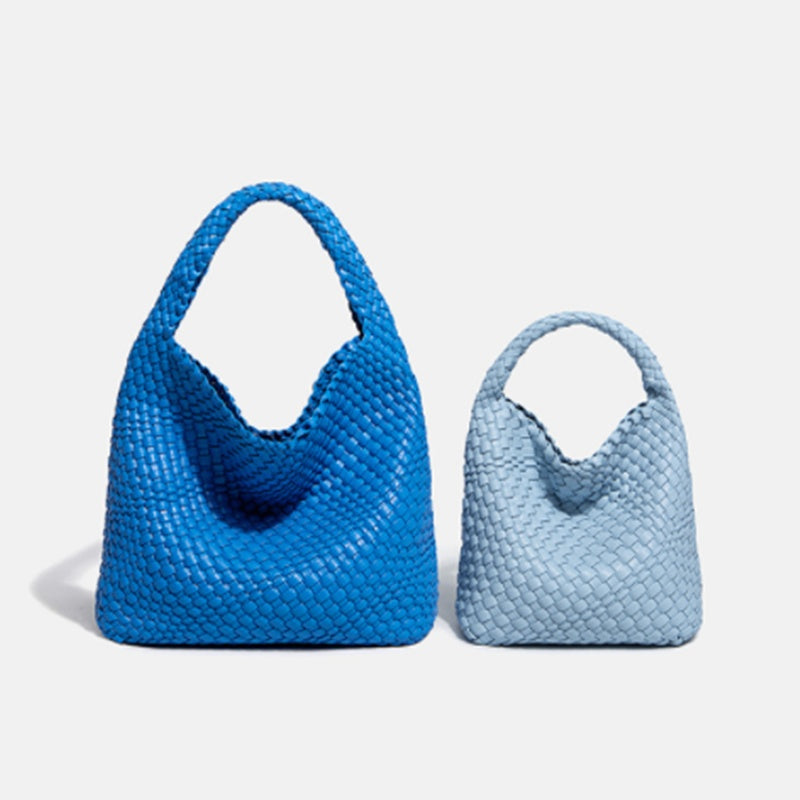 Two blue handbags, one larger and one smaller