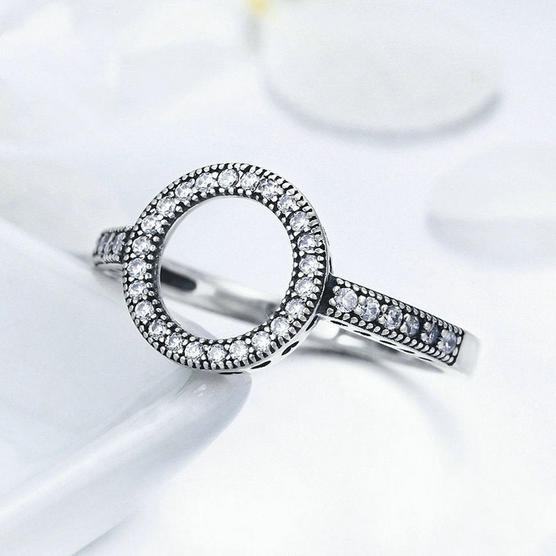 Close-up of minimalist silver promise ring on hand