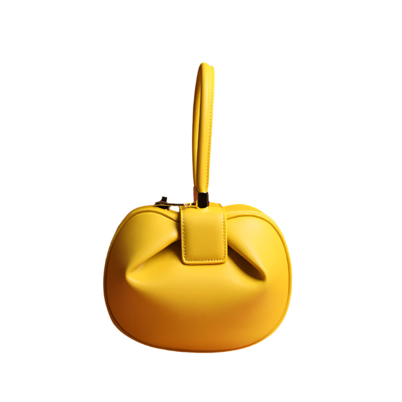 Polished and fashionable lyellow eather handbag with buckle closure