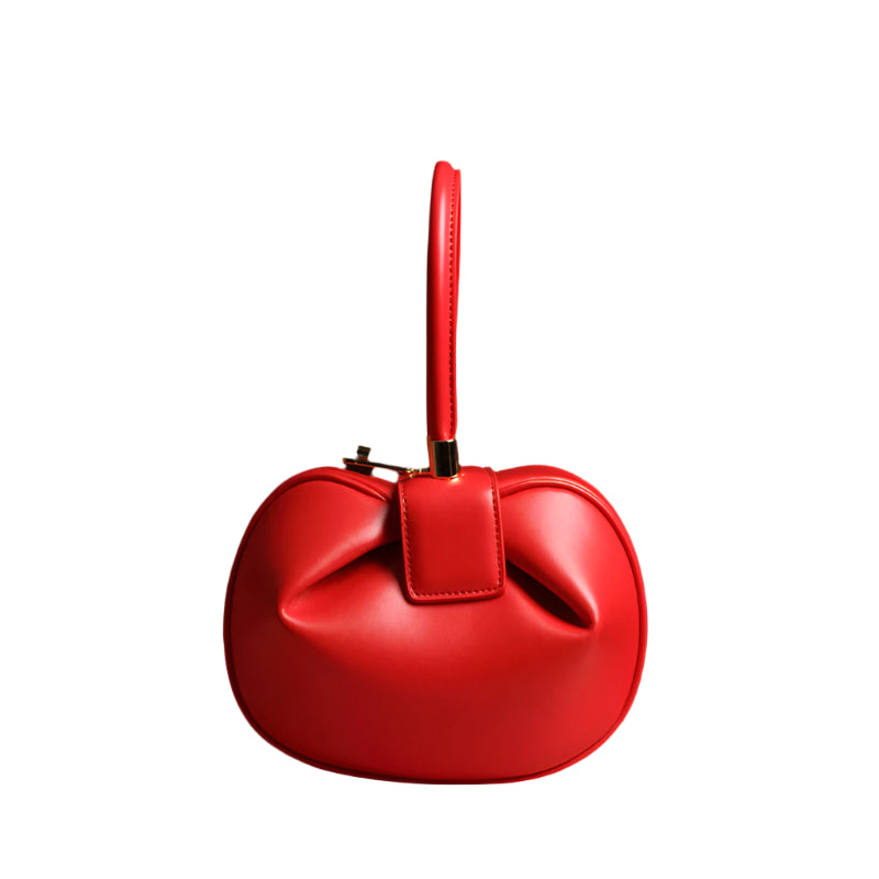 Red leather handbag with a bow detail