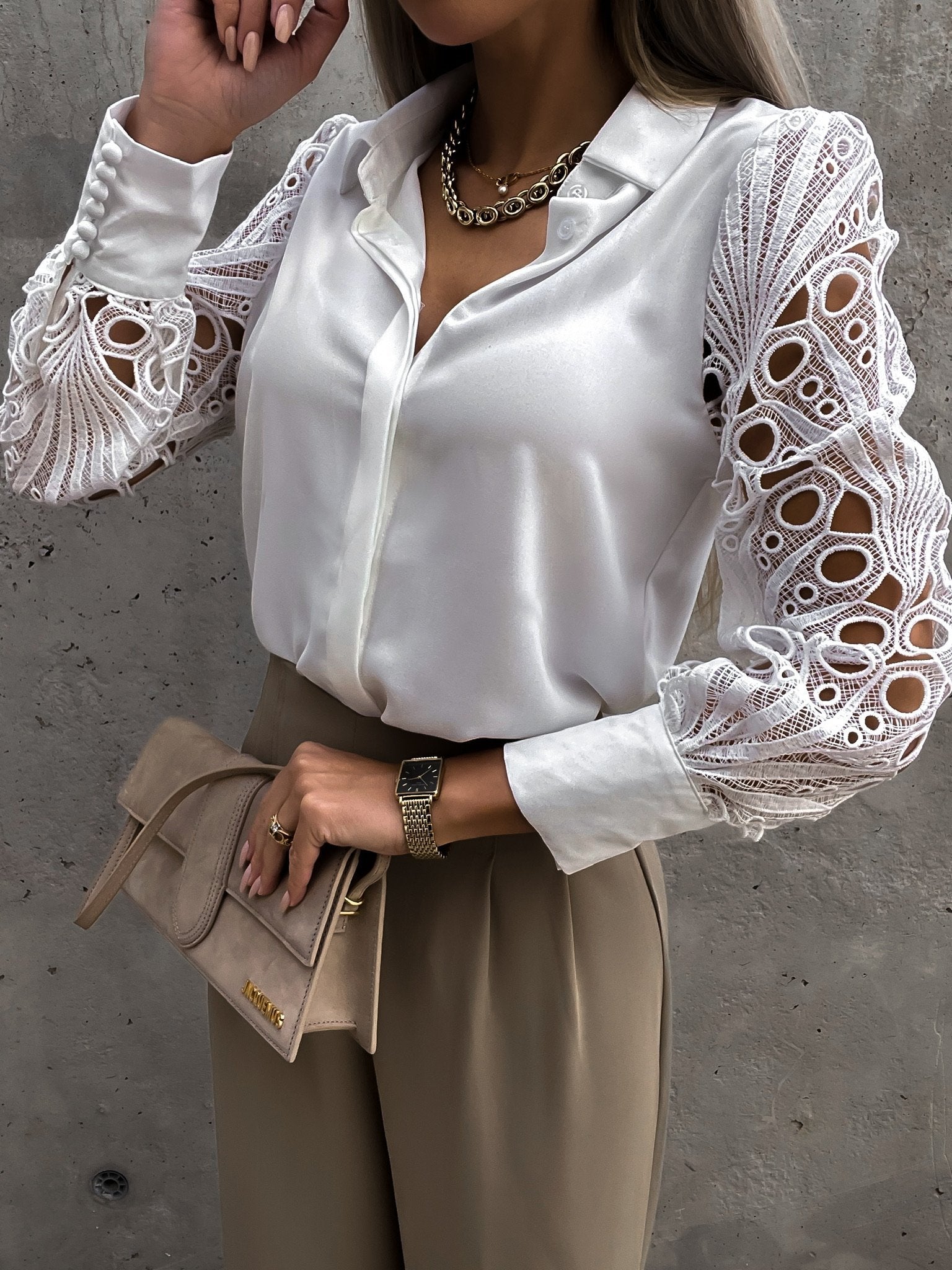Romantic white top styled with beige pants