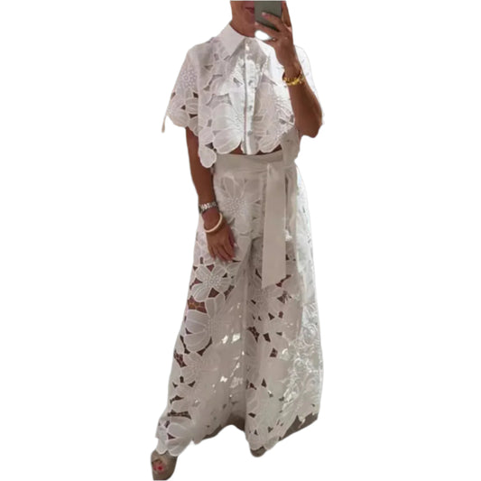 Person wearing a white lace outfit set Person wearing a white lace outfit set