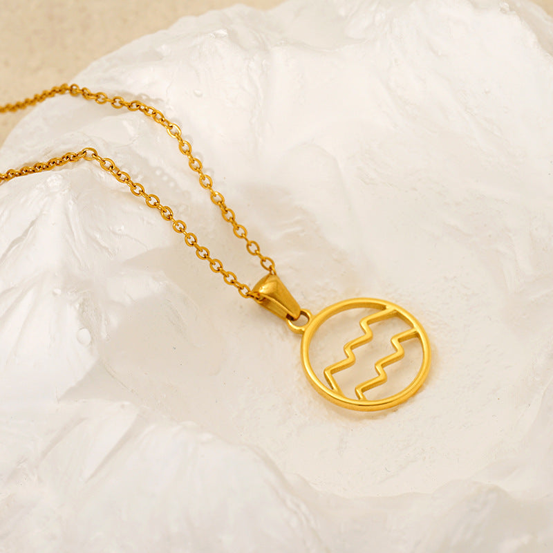 Gold necklace with a circular zodiac pendant