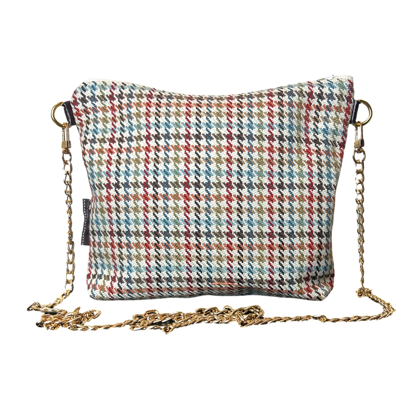 Multicolored houndstooth patterned bag with a gold chain strap on a white background