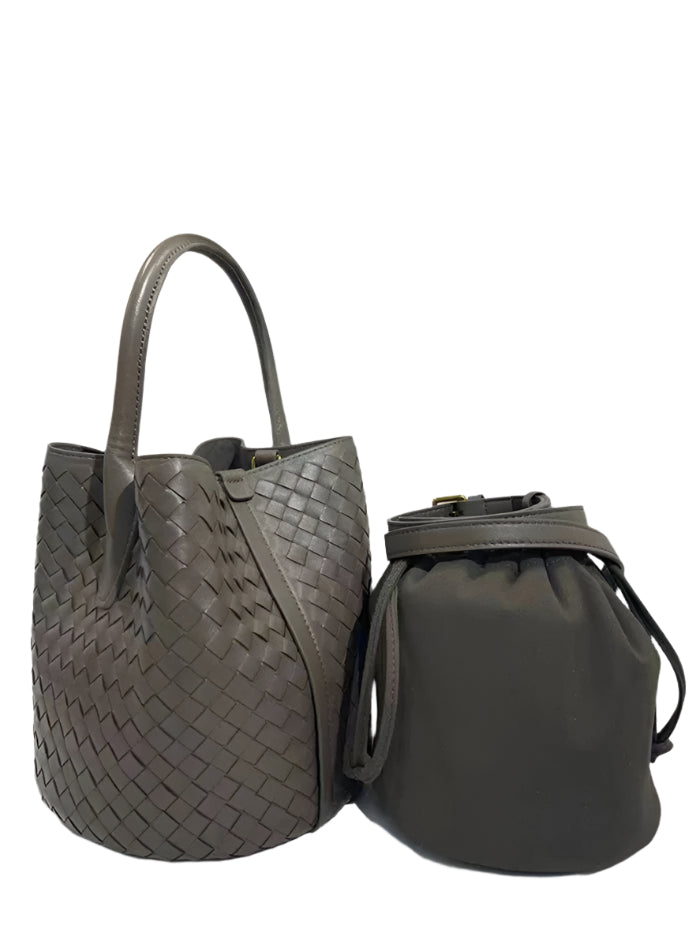 Two gray handbags, one woven and one drawstring