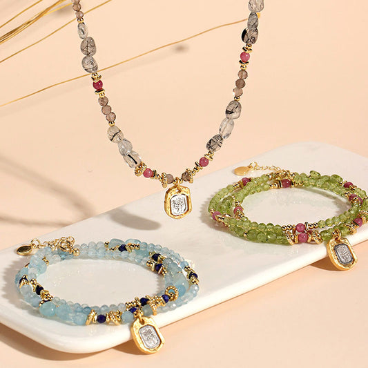 Set of beaded jewelry including a necklace and bracelets  Set of beaded jewelry including a necklace and bracelets