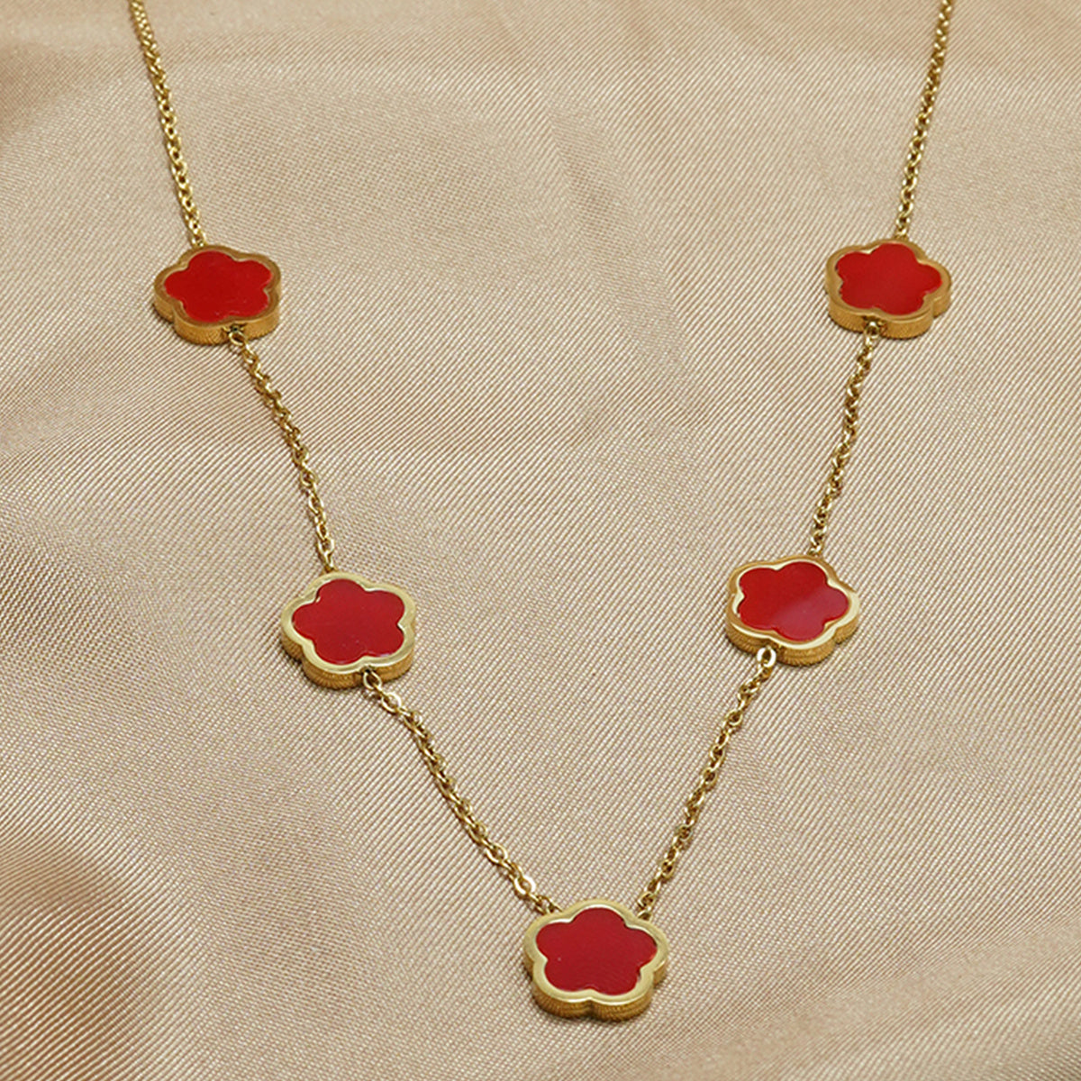 Necklace with red flower-shaped pendants
