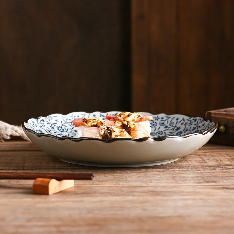 Close-up of underglaze floral design on porcelain plate