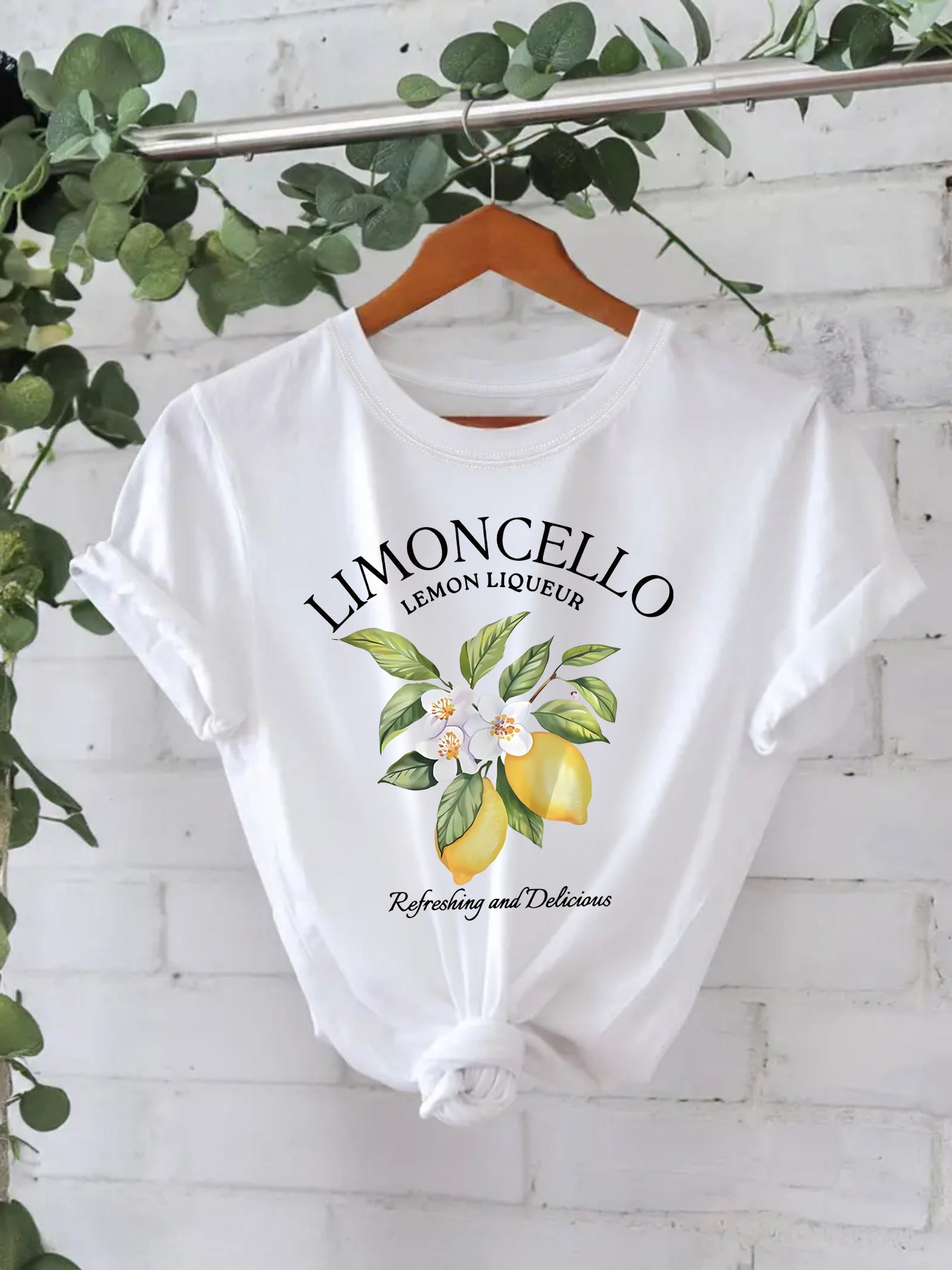 White Limoncello lemon graphic tee with white floral lemon branch print — women's casual cotton top