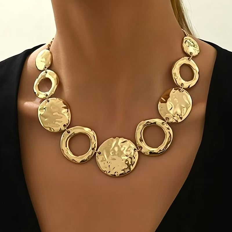 Gold necklace with circular and disc designs