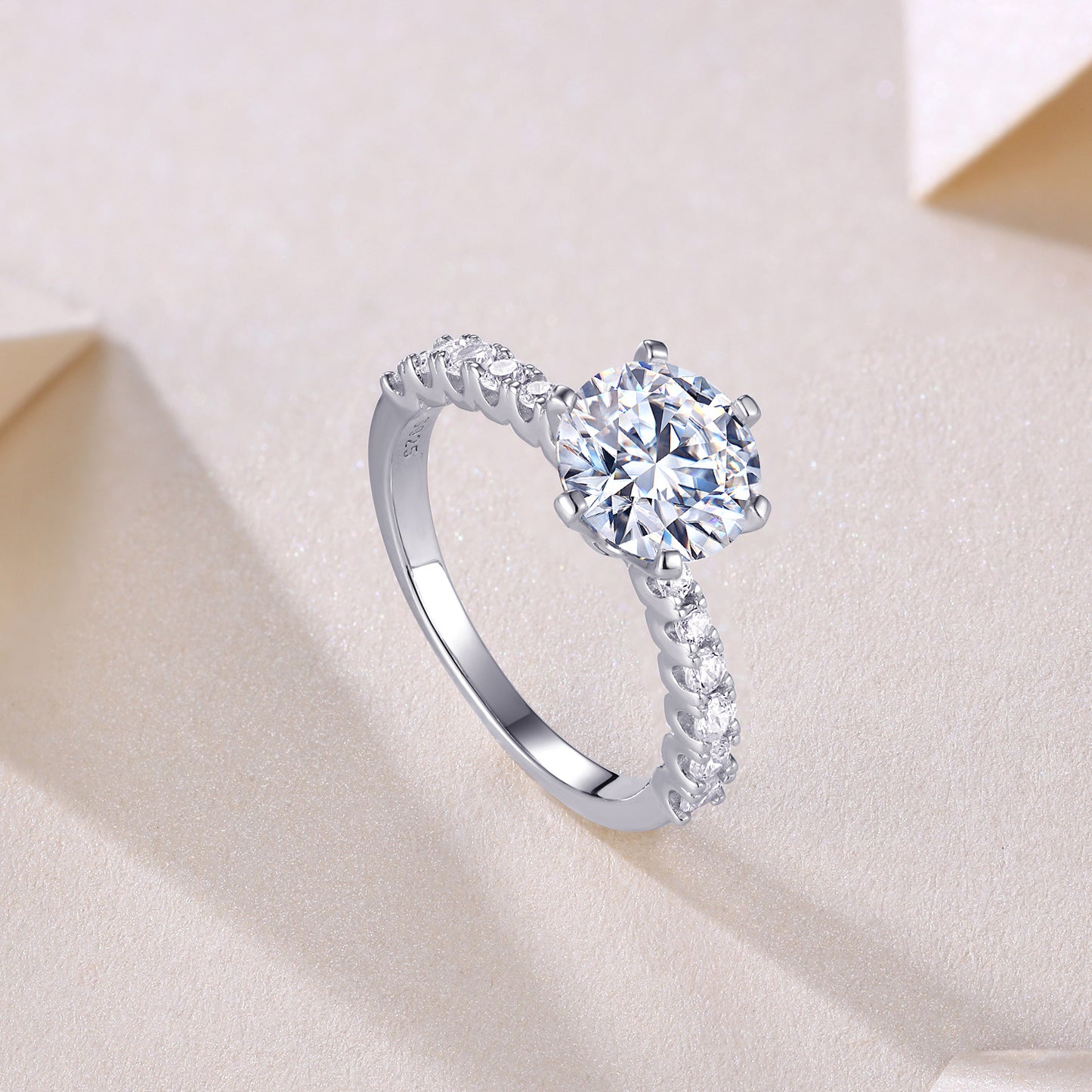 Silver ring with a large diamond and smaller diamonds in the side