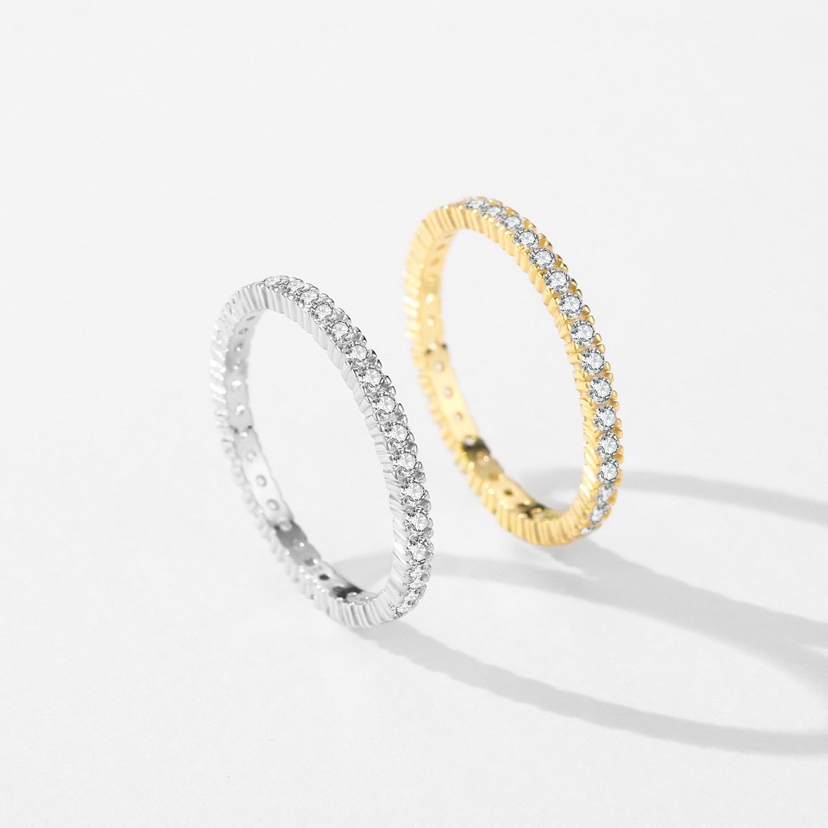 Two full eternity band for women one gold and one silver with diamonds