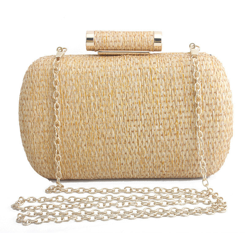 Beige woven clutch bag with a gold chain