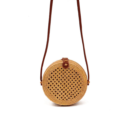 Round woven bag with a brown strap  Round woven bag with a brown strap