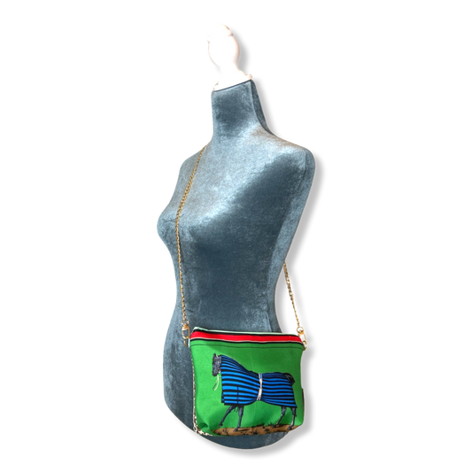 Green bag with horse design on a mannequin against a white background Green bag with horse design on a mannequin against a white background