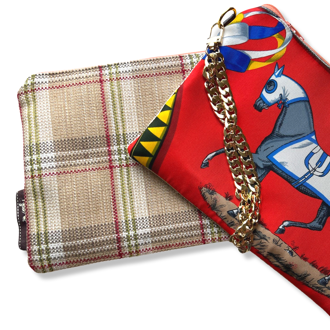 Plaid pouch with gold chain and red fabric with horse design on a white background