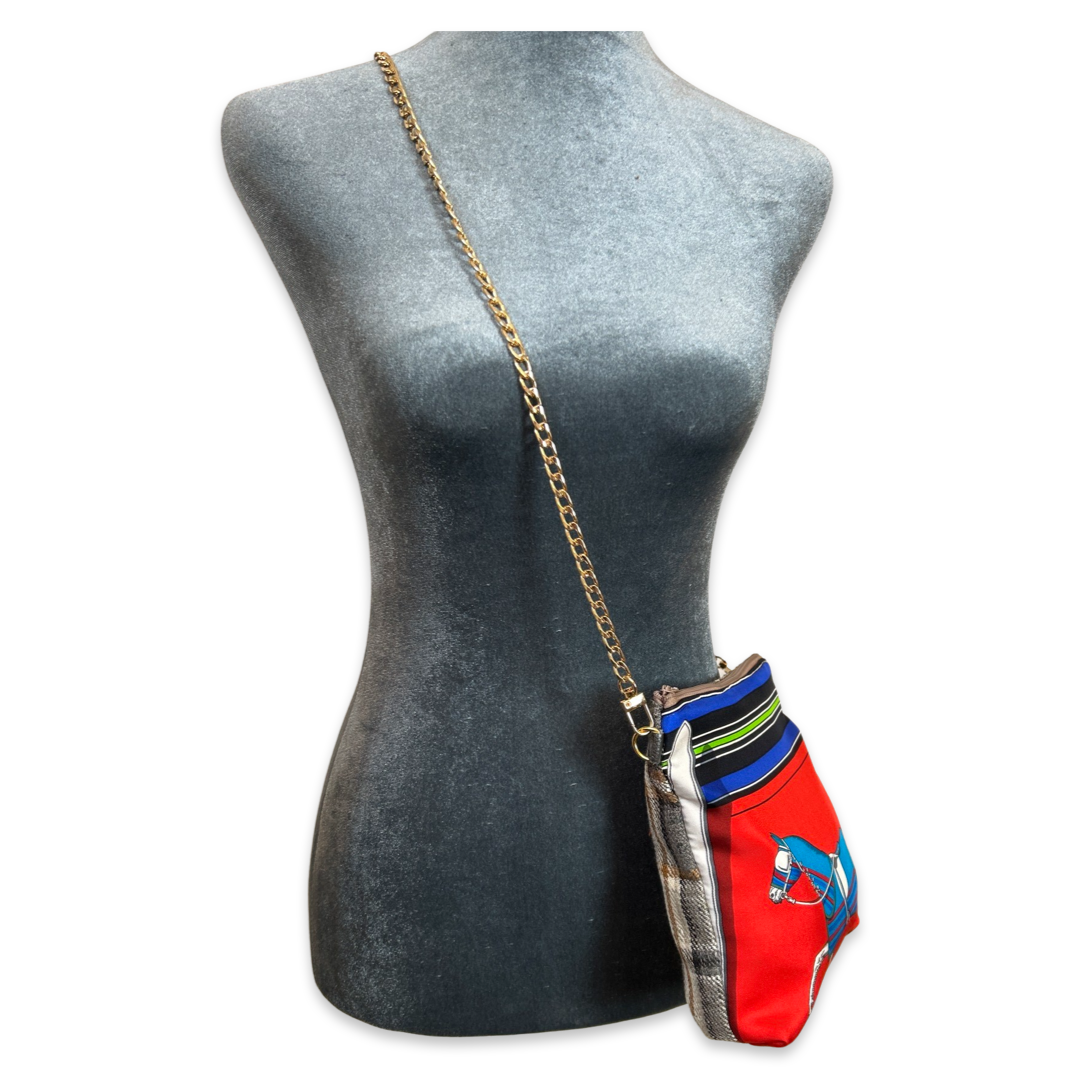 Colorful handbag with chain strap on a mannequin bust