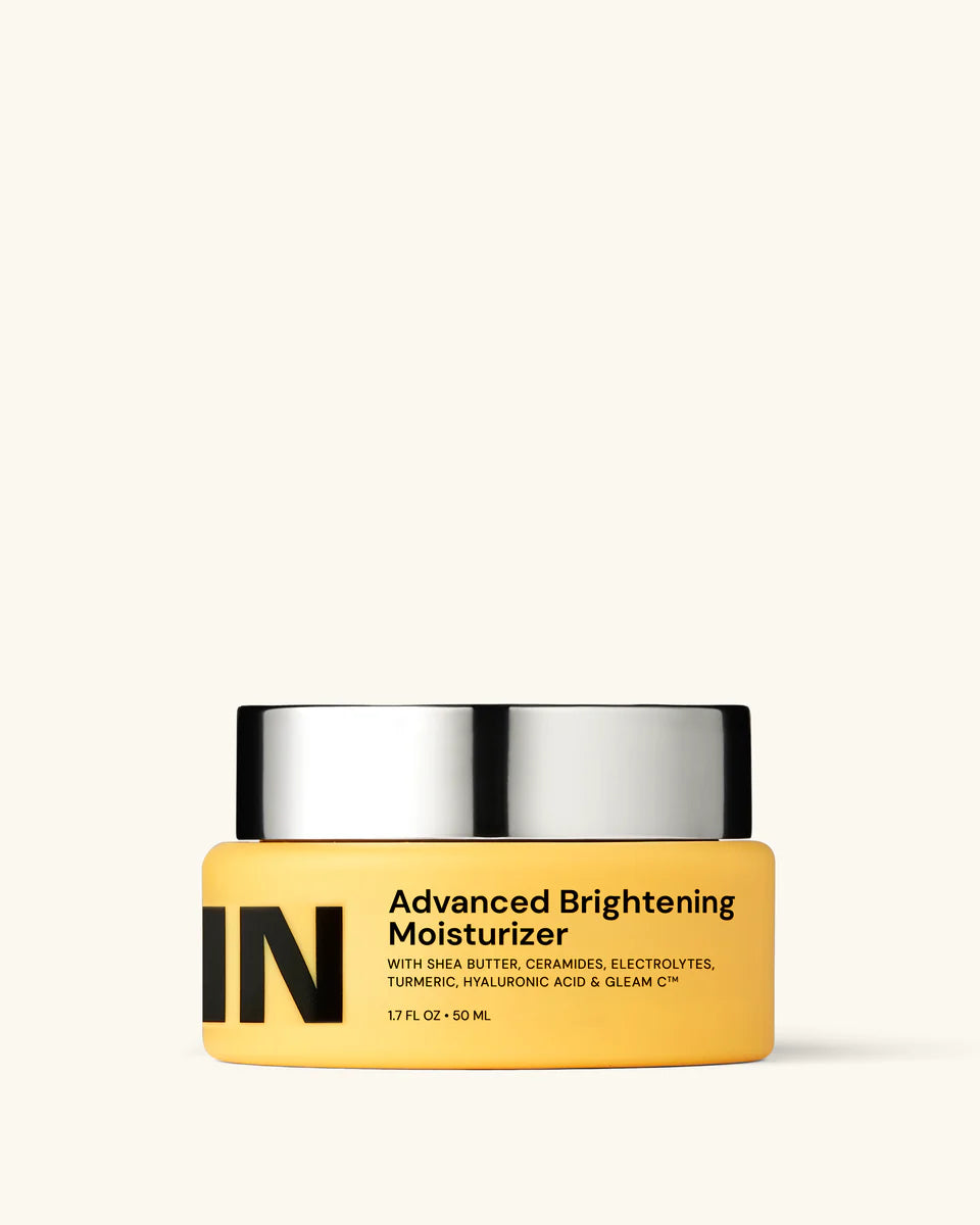 Yellow jar of 'Advanced Brightening Moisturizer' with black text on a white background