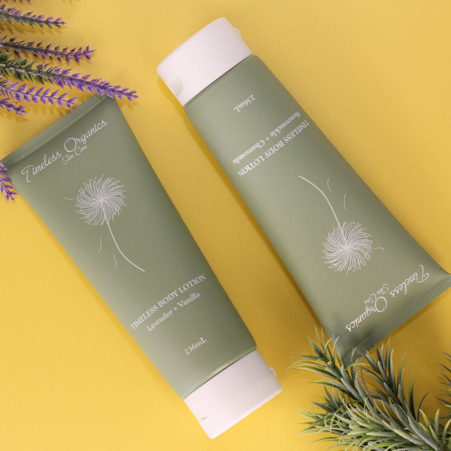 Two green skincare products with white caps on a yellow background with lavender and rosemary.