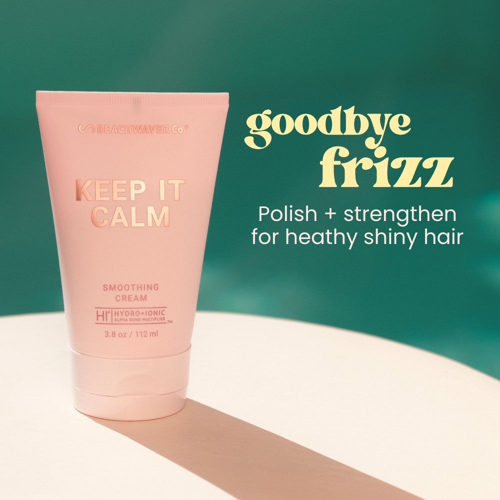 Pink hair care product with text 'Keep It Calm' and 'Goodbye Frizz'