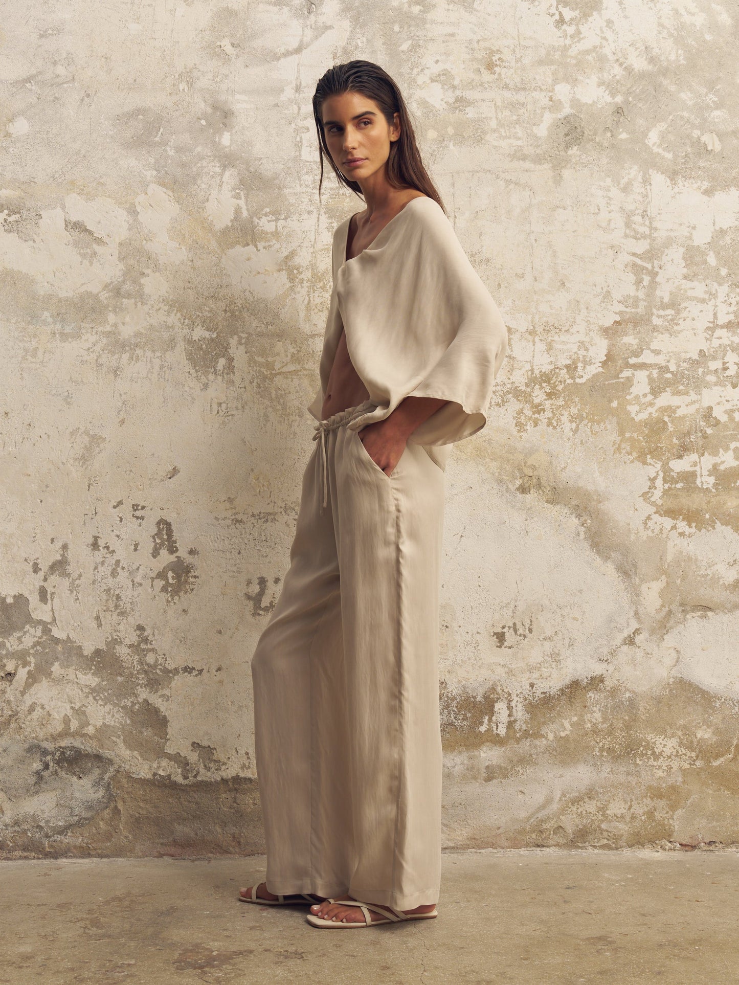 Model walking in flowy TENCEL Luxe pants