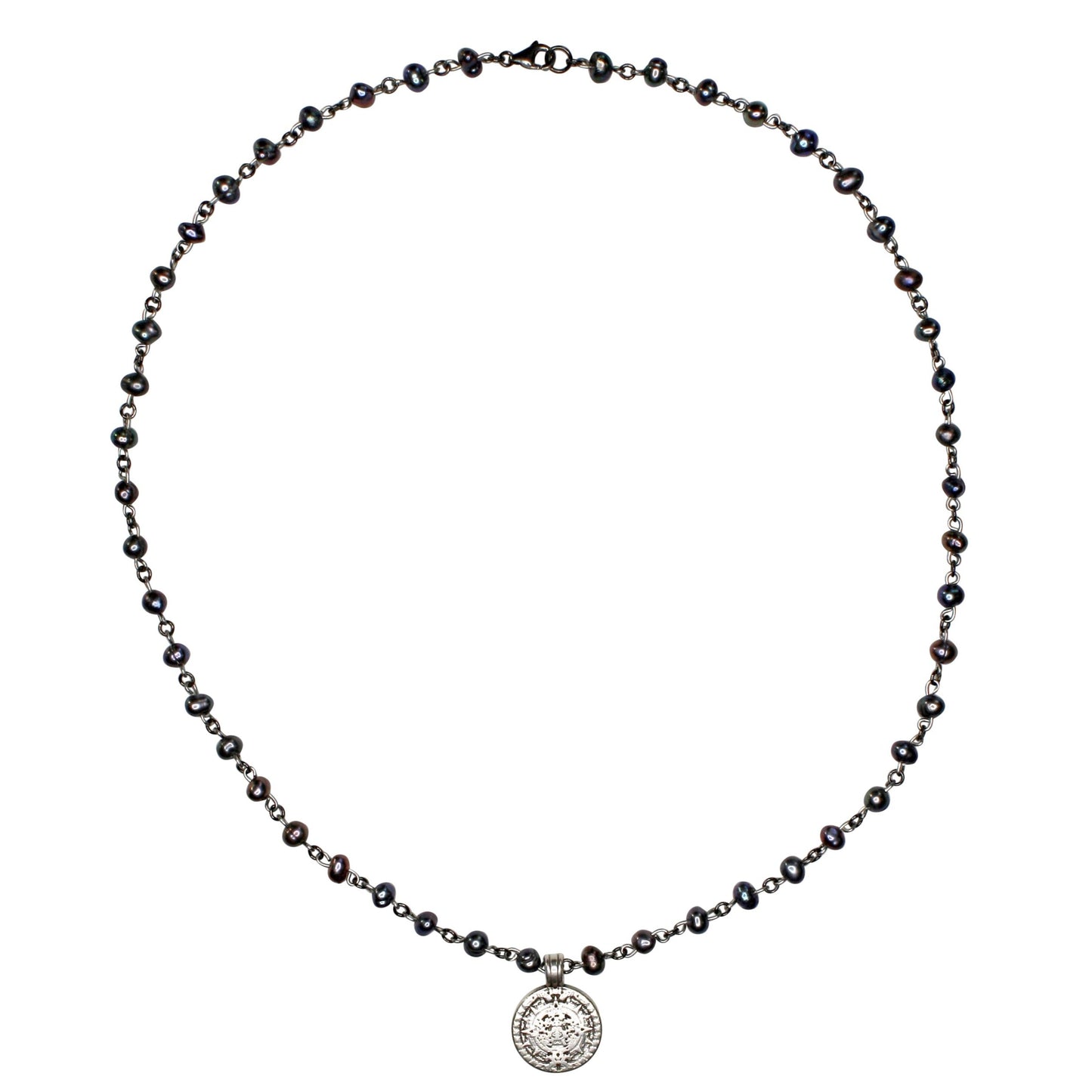 Necklace with black beads and a silver pendant on a white background