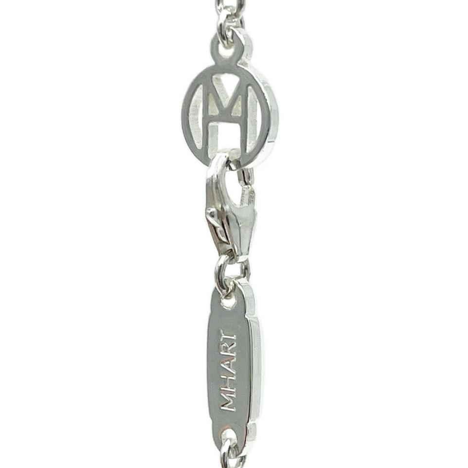 Silver bracelet with engraved name on a white background