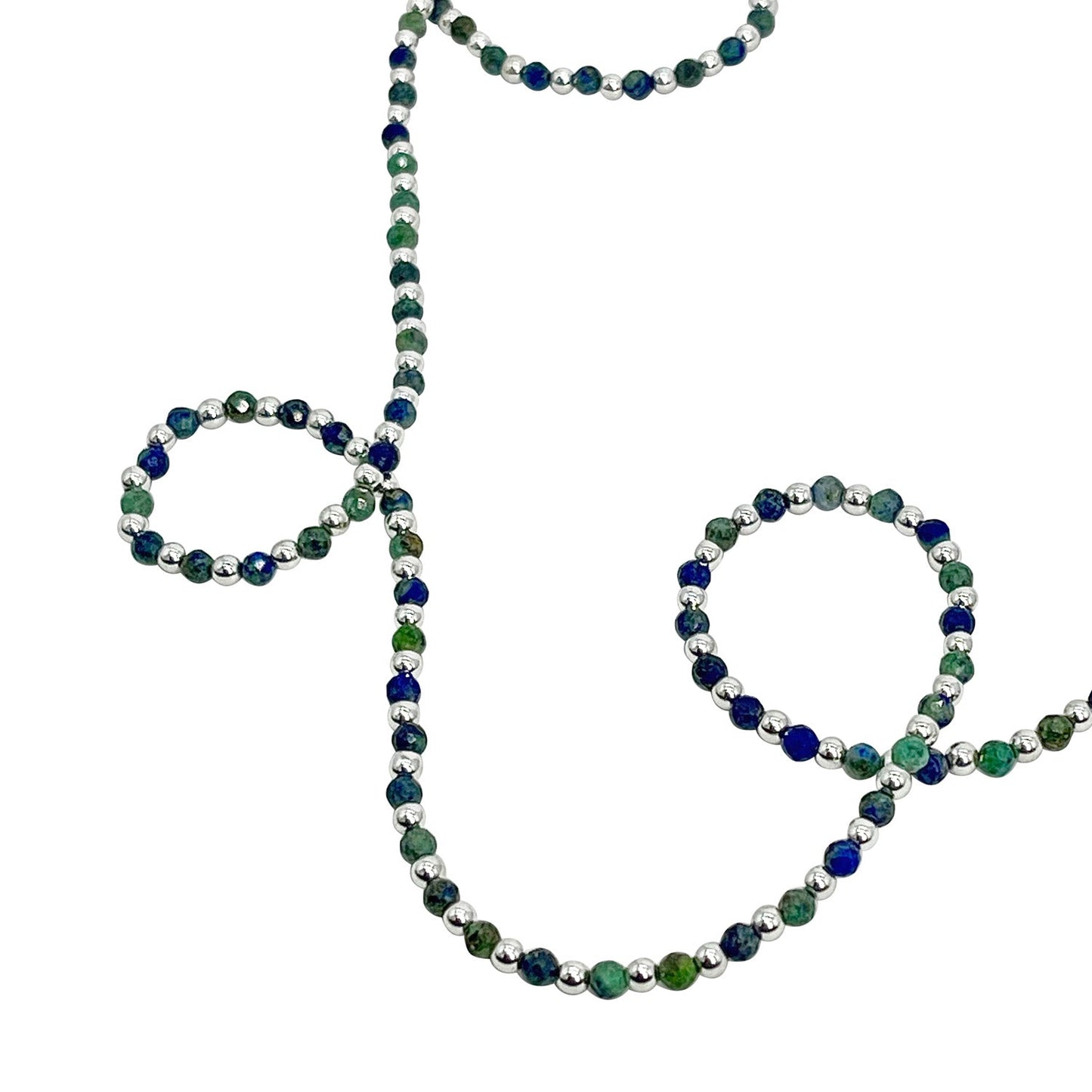 Beaded necklace with green, blue, and silver beads on a white background