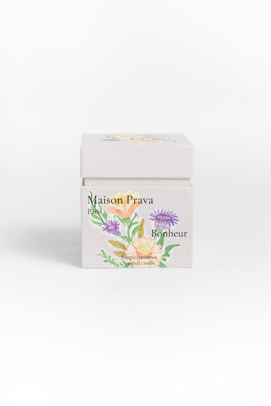 Maison Prava candle packaging with floral design  Maison Prava candle packaging with floral design