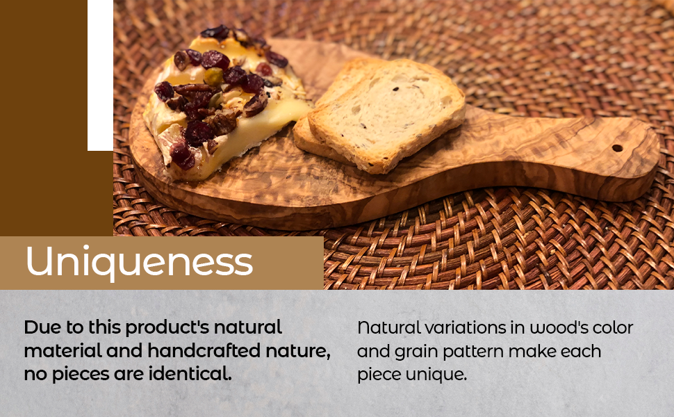 Wooden cutting board with bread and cheese on a woven surface, highlighting uniqueness.