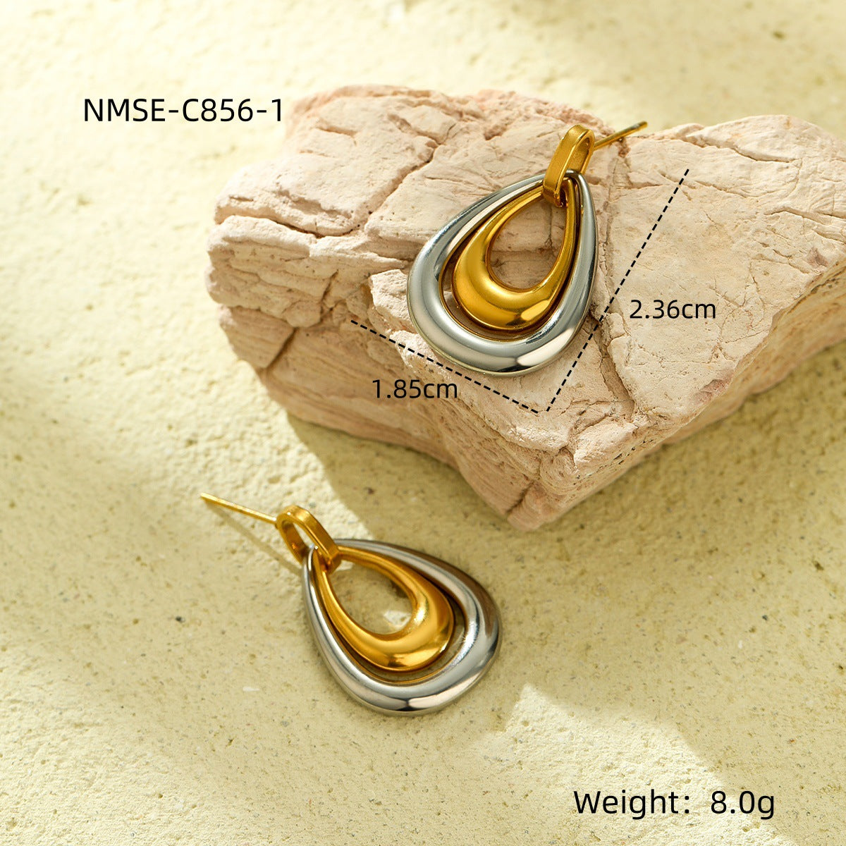 Gold and silver teardrop-shaped earrings