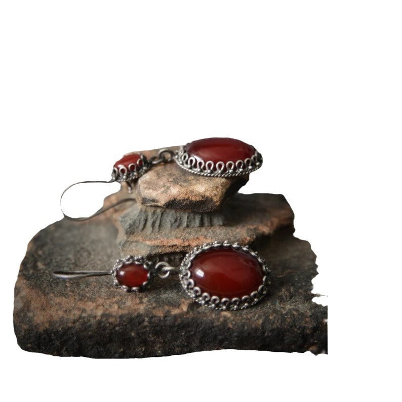 Jewelry set with red stones and silver accents