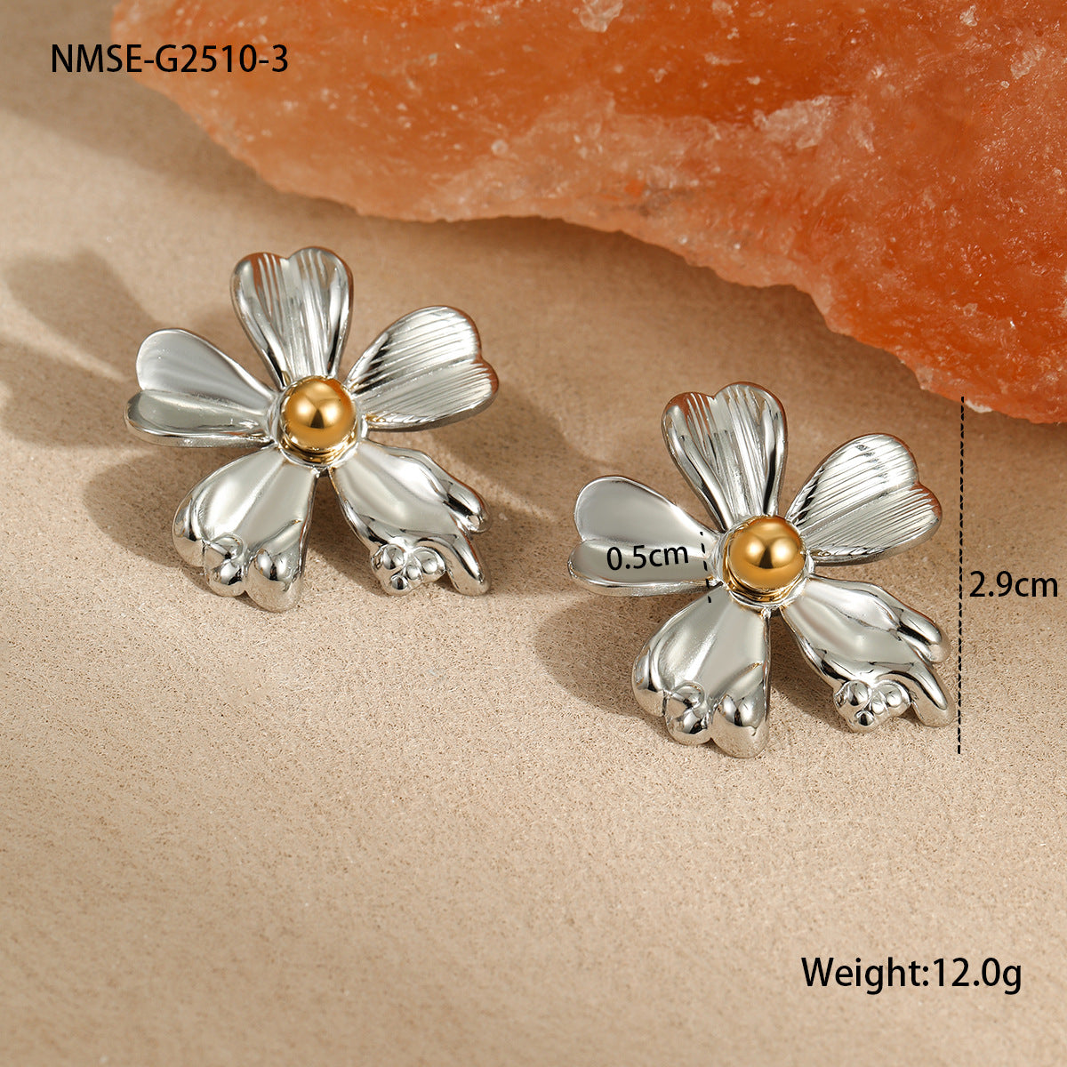 Flower-shaped silver and gold earrings