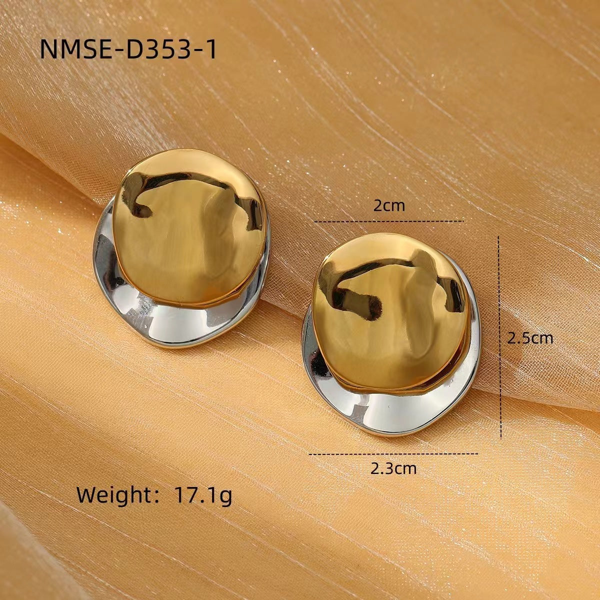 Two gold and silver round earrings