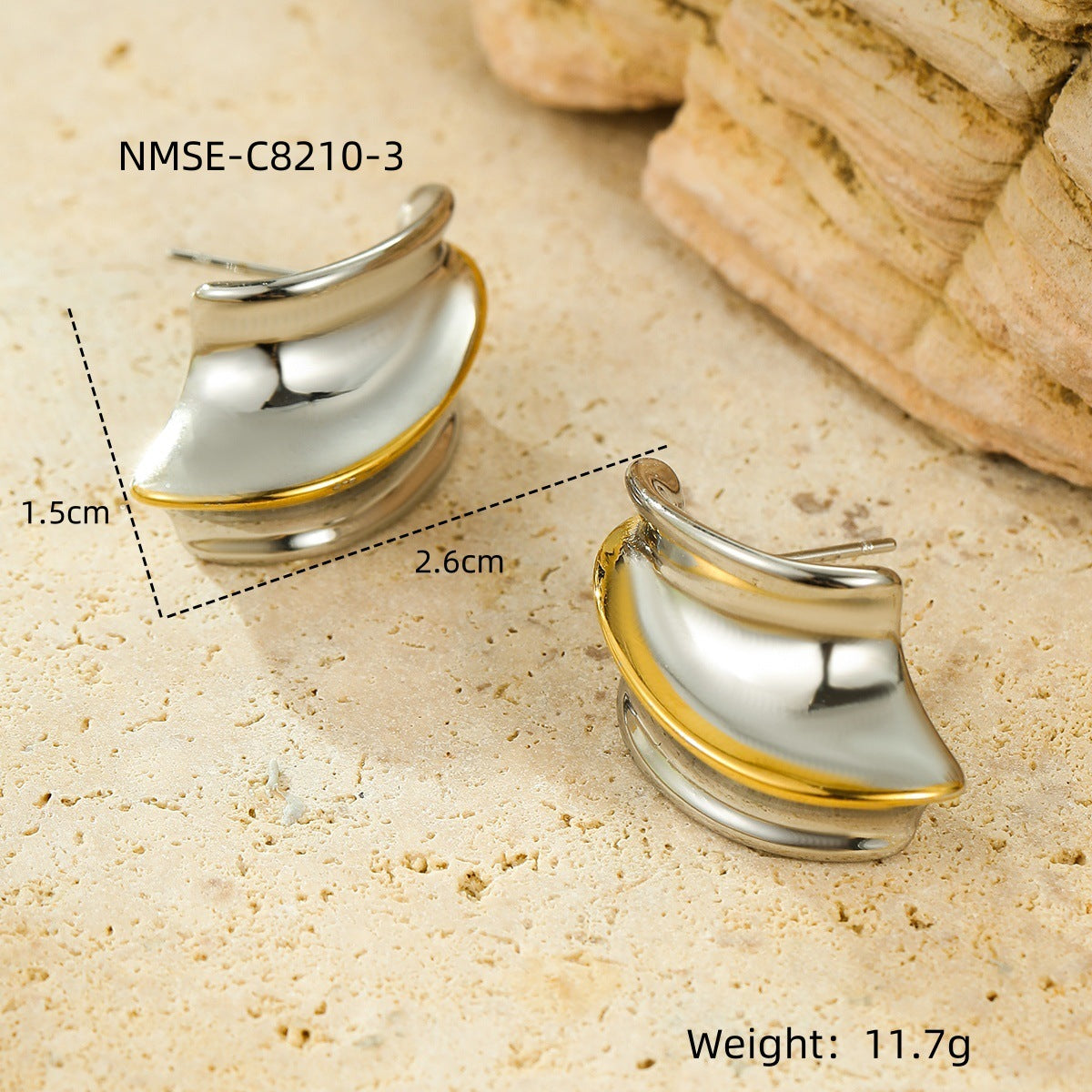 Pair of silver and gold earrings