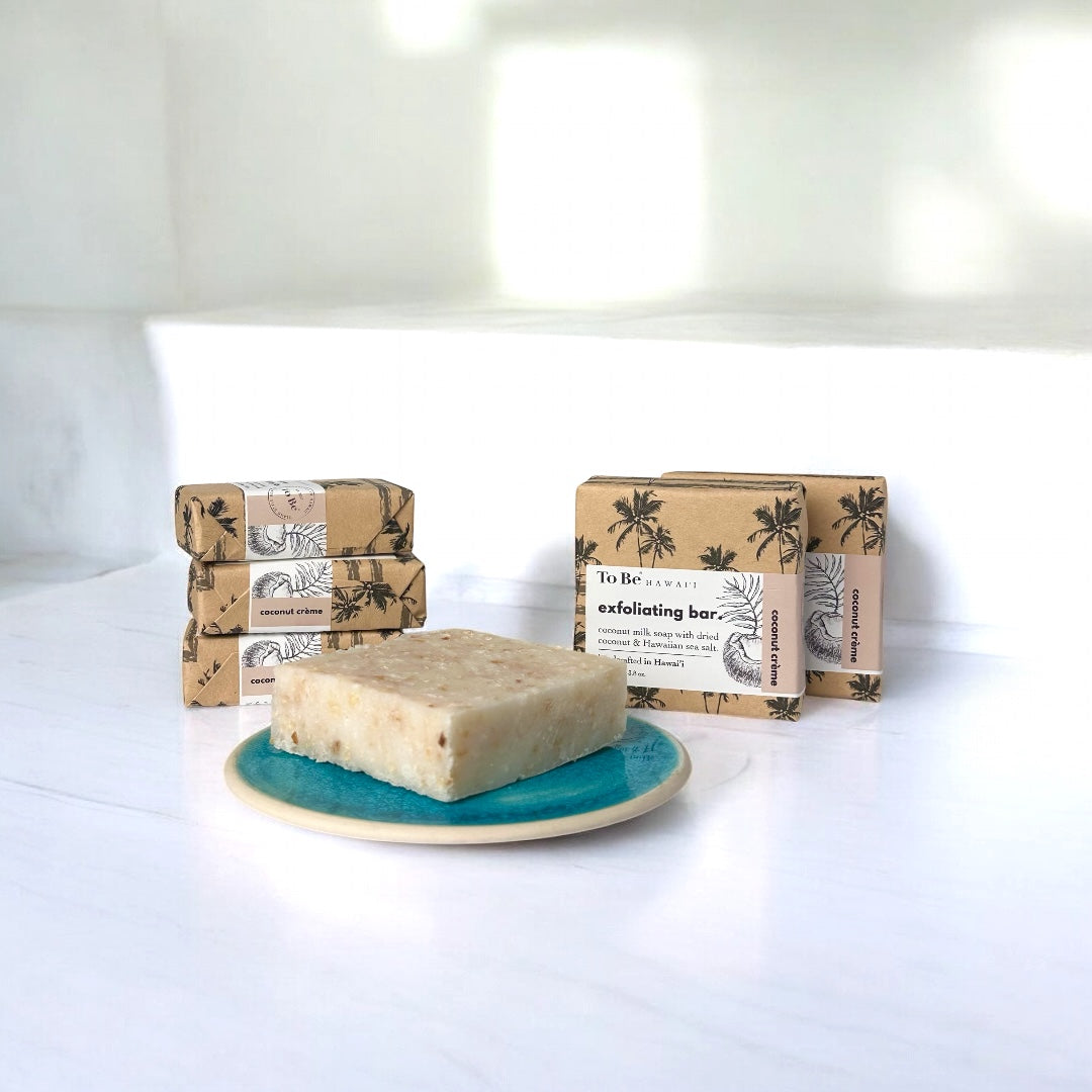 Bar of soap on a blue plate with packaging