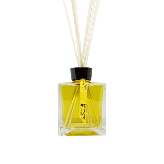 Yellow diffuser bottle with black cap and white sticks