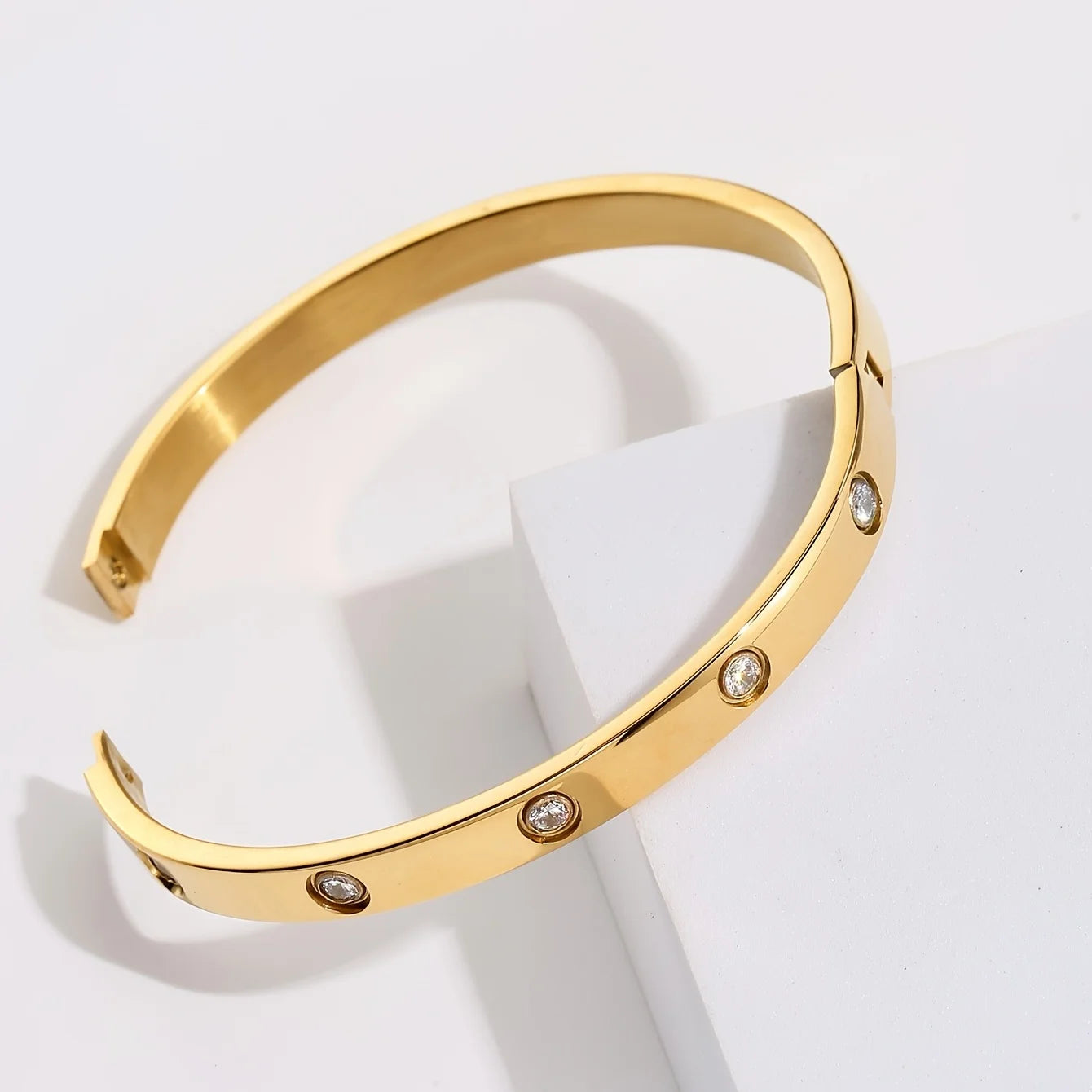 Gold bracelet with embedded diamonds