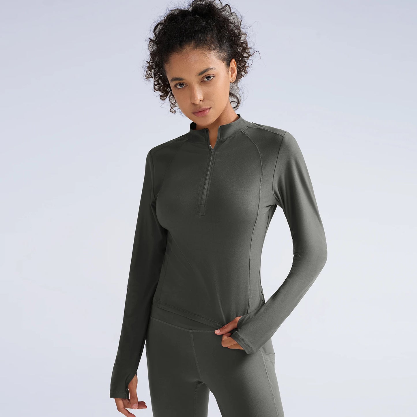 Women exercising in half zip training t-shirt