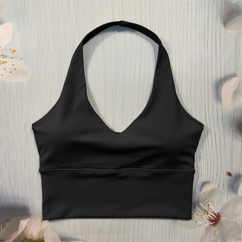 Black sports bra on a light wooden surface